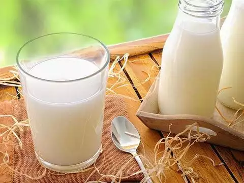 A visual representation of a pint of milk, highlighting various factors that influence its price, such as production costs and market dynamics.