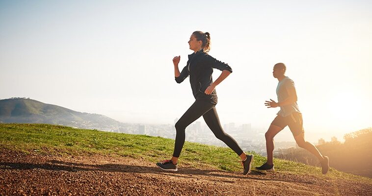 A person jogging on a scenic trail, symbolizing the continuous journey of physical fitness through consistent exercise, progress, and healthy lifestyle choices.