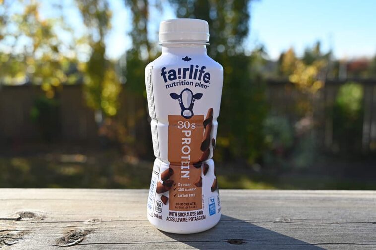 A bottle of Fairlife Protein Shake with a label highlighting its high protein content, low sugar, and essential nutrients like calcium and vitamin D.